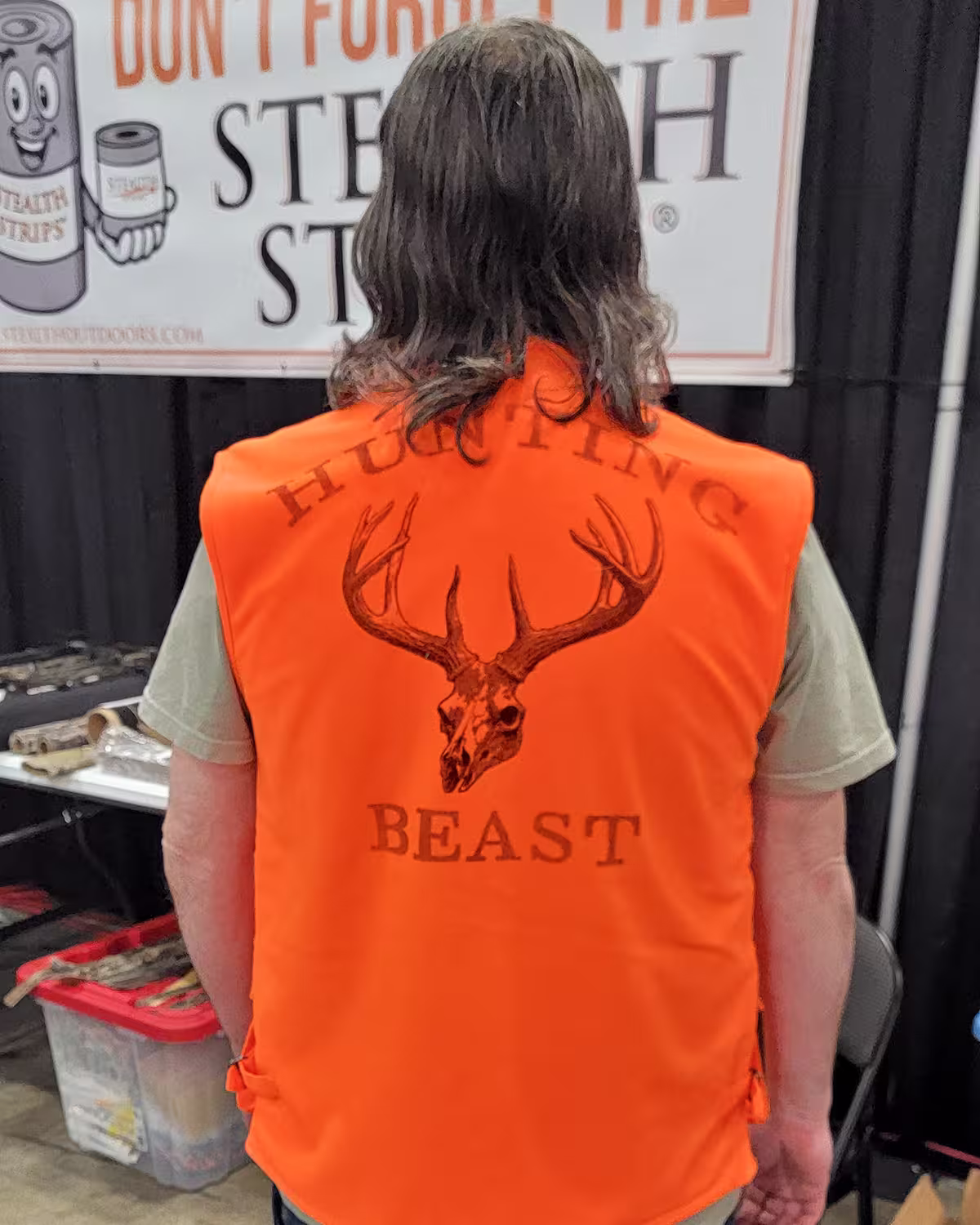 Hunting Beast Tactical Vest in Safety Orange back on person