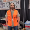 Hunting Beast Tactical Vest in Safety Orange front on person