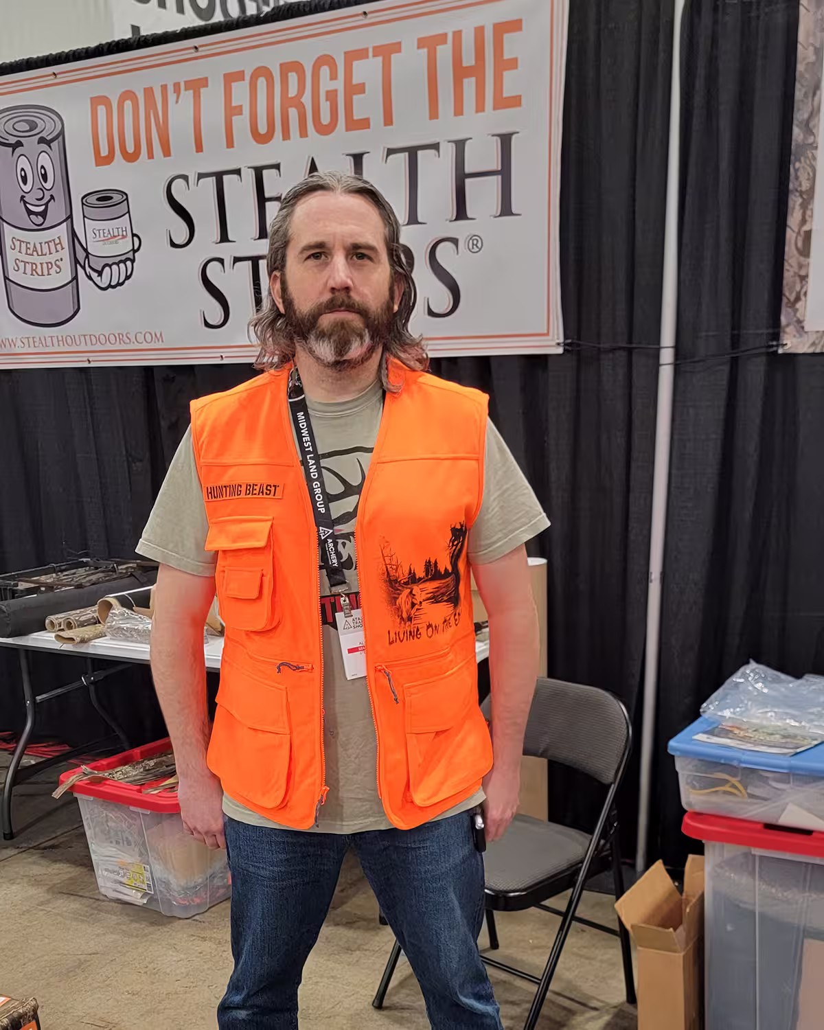 Hunting Beast Tactical Vest in Safety Orange front on person